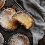 Slice of Baby Lemon Impossible Pie showing creamy texture and golden crustless edge.
