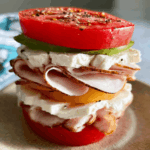 Supermodel Snack Recipe plated with tomato, turkey, and cottage cheese