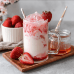 korean strawberry milk in a clear layered glass