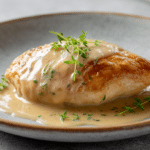 Creamy Garlic Parmesan Chicken Breast in a skillet with spinach