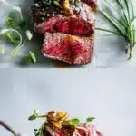 Sliced beef tataki with a rare rosy center, drizzled with glossy ponzu sauce, topped with crispy golden garlic and fresh green herbs on a dark ceramic plate.
