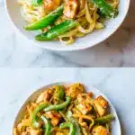 A bowl of creamy cajun chicken pasta with golden seared chicken pieces, sliced green bell peppers, and a glossy sauce, served on a bright marble countertop.