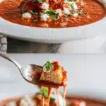 A close-up, steaming bowl of rich red Instant Pot Lasagna Soup with a generous swirl of creamy ricotta cheese, melted mozzarella, and fresh green basil leaves on top, with a spoon resting on the side of the rustic ceramic bowl.