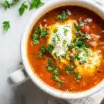 A bowl of Lasagna Soup Recipe with ricotta and mozzarella