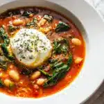 A bowl of Vegetarian Lasagna Soup with ricotta and mozzarella cheese.