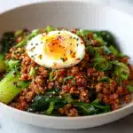 A bowl of glossy spicy chili crisp noodles recipe ready to eat