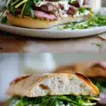 Close-up of a gourmet steak sandwich on ciabatta bread, filled with perfectly pink sliced skirt steak, vibrant green arugula leaves, and a glossy, creamy horseradish sauce dripping down the side, resting on a rustic wooden cutting board.